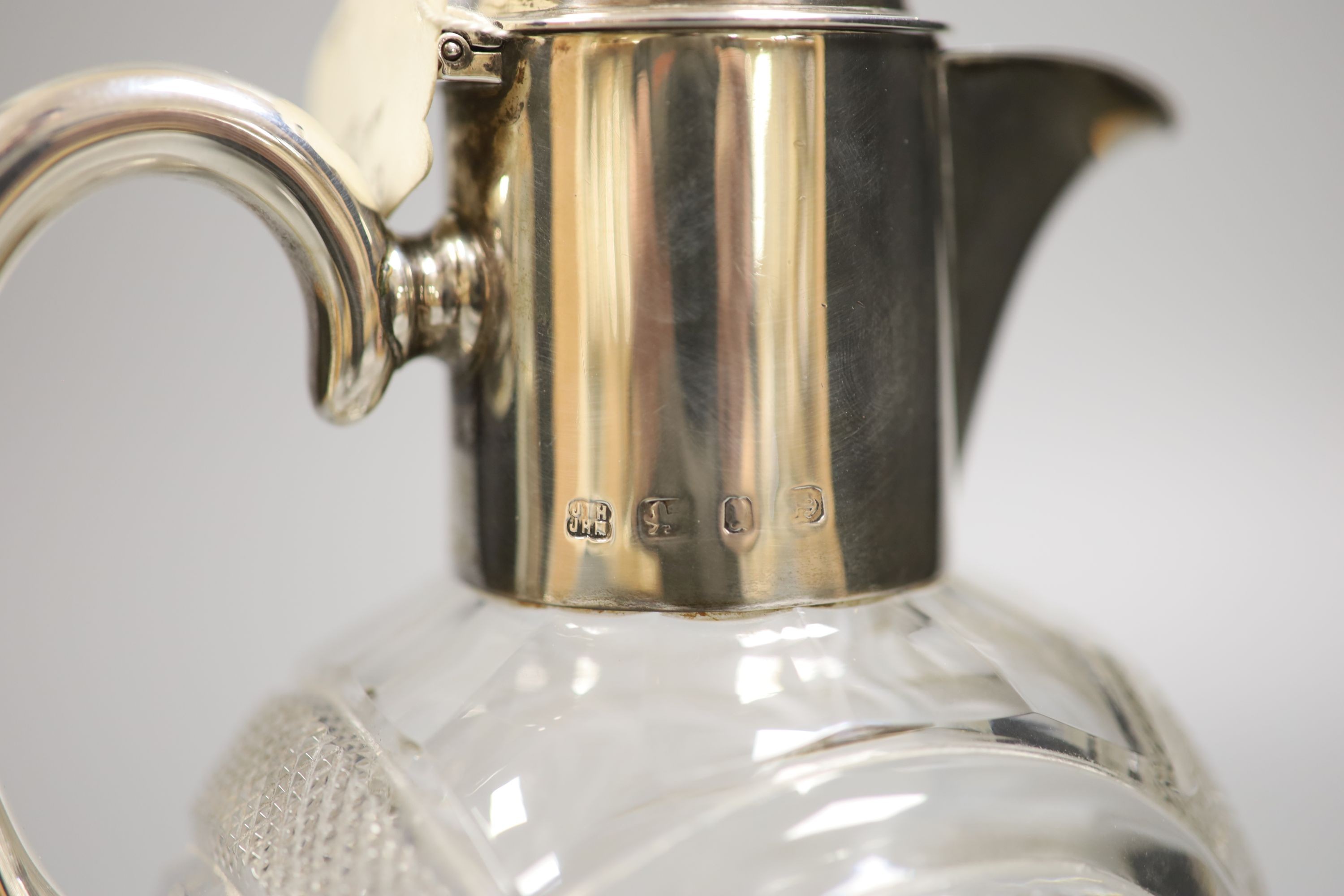 A late Victorian silver mounted cut glass claret jug, Hukin & Heath, Birmingham, 1898, 20.4cm.